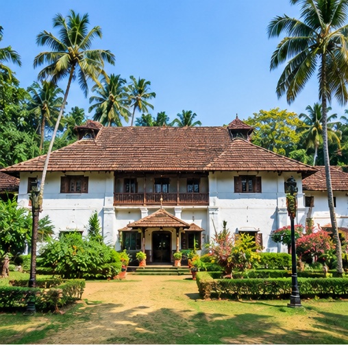 Traditional Kerala palace with tiled roof and courtyard